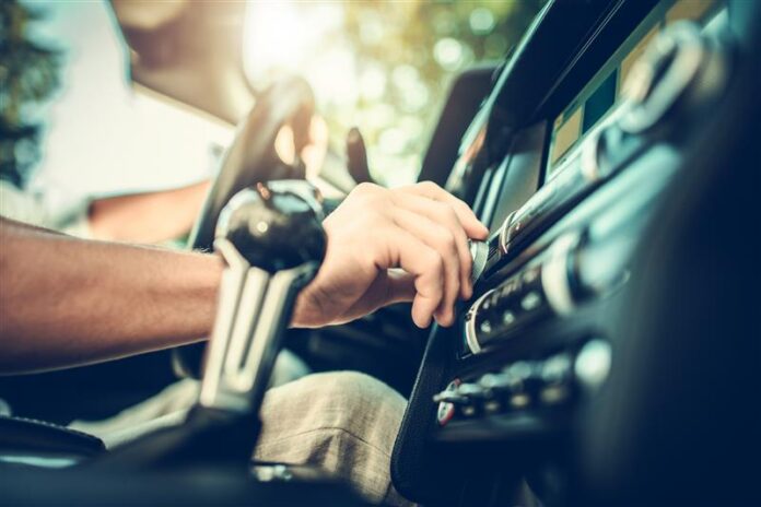 Commuter listening to radio commercials